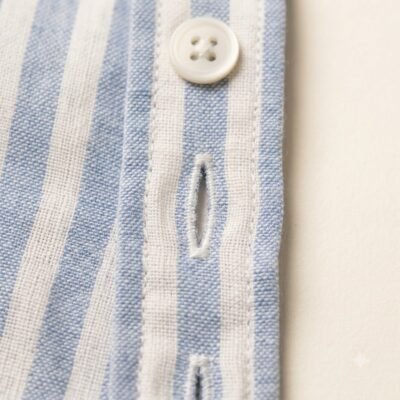Macro_fashion_photography_of_but…_20260922213254 STRIPE SHIRT SKY BLUE